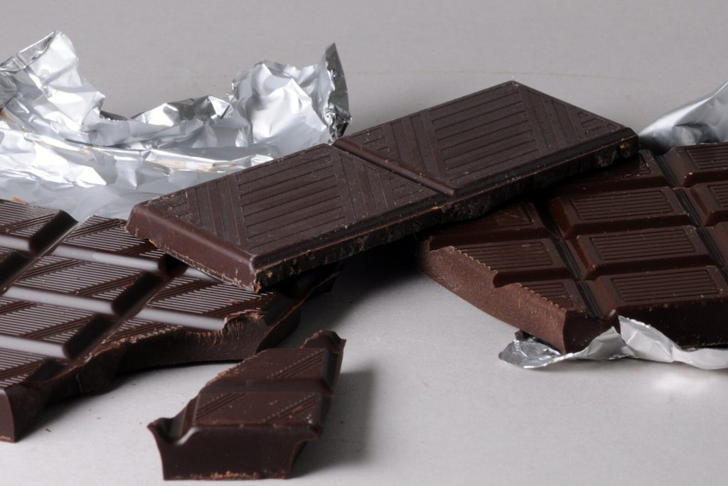 Chocolate — Bars of dark chocolate, broken into pieces